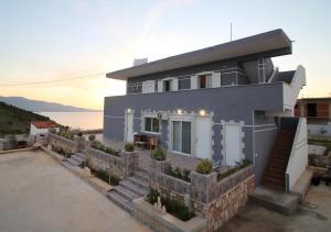 a house with a view of the ocean at Le Gjero luxury villa in Ksamil
