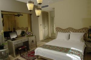 a bedroom with a large bed and a large window at Sokullu Pasa Hotel - Special Class in Istanbul