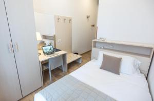Posteľ alebo postele v izbe v ubytovaní Nuovo Albergo Centro