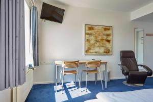 TV a/nebo společenská místnost v ubytování BB-Hotel Aarhus Havnehotellet