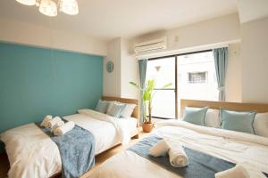 Tempat tidur dalam kamar di Roppongi Azabu Gorgeous Sea House