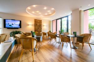 TV a/nebo společenská místnost v ubytování Hotel Wald und See