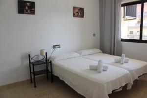 Łóżko lub łóżka w pokoju w obiekcie Apartamento Ronda IV - Los Boliches