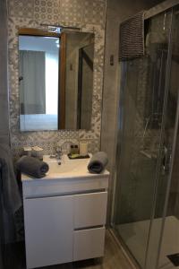 a bathroom with a sink and a shower at Hostal Don Peque Adult Recommended in Nerja