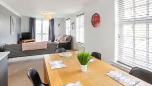 a living room with a table and a couch at Fountains view Apartment in York