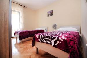 Postel nebo postele na pokoji v ubytování villa red hill
