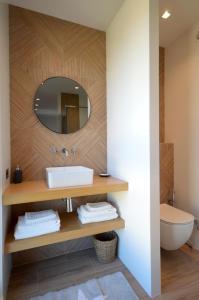 a bathroom with a sink and a mirror at Magnifique Studio à deux pas du port de Saint-Tropez in Saint-Tropez