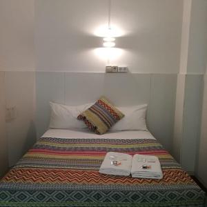 Postel nebo postele na pokoji v ubytování Central and Basic Universitat for YOUNG HOSTEL