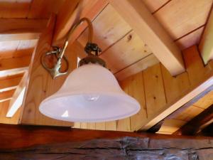 a light hanging from the ceiling of a cabin at Chambres d'Hôtes Agorerreka in Saint-Étienne-de-Baïgorry +55 photos