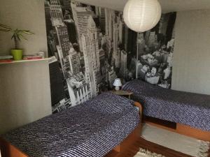 A bed or beds in a room at Apartman Melody