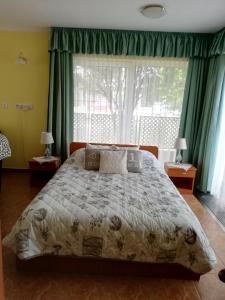 A bed or beds in a room at Bokreta Udulohaz