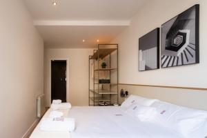 Posteľ alebo postele v izbe v ubytovaní Petit Luxe Tobella Baixos