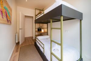 Posteľ alebo postele v izbe v ubytovaní Petit Luxe Tobella Baixos