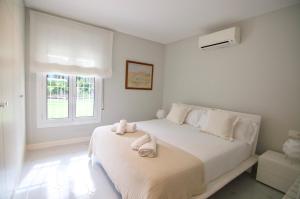 Postel nebo postele na pokoji v ubytování Luxury Beach House