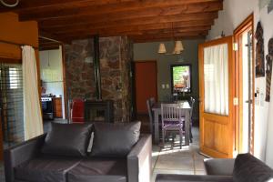 a living room with a couch and a table at La Ventarrón in Mar de las Pampas