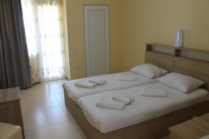 Letto o letti in una camera di Okro Life