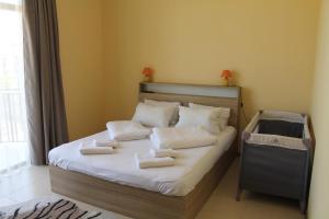 Letto o letti in una camera di Okro Life