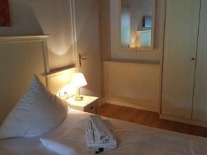 Ein Bett oder Betten in einem Zimmer der Unterkunft Sylter Besserburg App. 2P