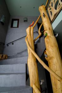 a set of stairs in a room with aadders at Apartamenty Inny Świat Zakopane in Zakopane