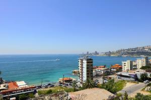 a view of a city and the ocean at President Hotel in Jounieh