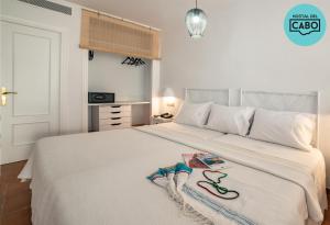 Cama o camas de una habitación en Hostal del Cabo