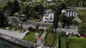 an aerial view of a castle with cars parked on the street at Hotel Villa Ruscello in Baveno