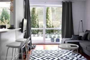 Posedenie v ubytovaní APARTAMENT TARASY GDYNI z OGRÓDKIEM