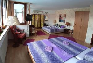 מיטה או מיטות בחדר ב-Hostel Pansion Lion