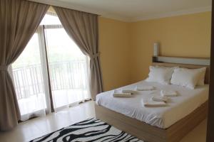 Letto o letti in una camera di Okro Life