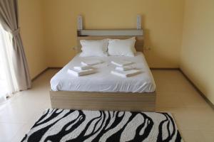 Letto o letti in una camera di Okro Life