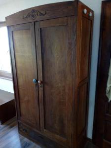 a wooden cabinet sitting next to a wall at Casa Del Grey in Balchik