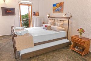 Posteľ alebo postele v izbe v ubytovaní Villa Kastania