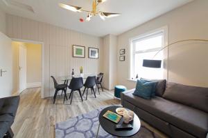 a living room with a couch and a table at Blackbird Luxury Apartments Room 2 in Blackpool