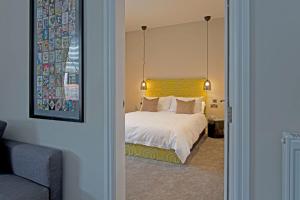En eller flere senge i et værelse på Blackbird Luxury Apartments Room 2