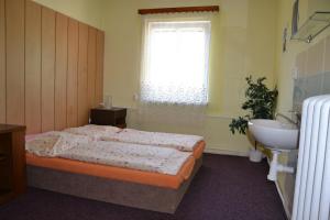 Posteľ alebo postele v izbe v ubytovaní Hostel Fortuna