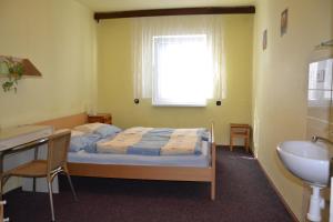 Posteľ alebo postele v izbe v ubytovaní Hostel Fortuna