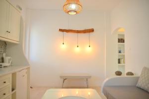 a living room with a couch and a table at Veletas Apartments in Adamantas +66 photos