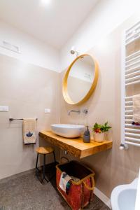 a bathroom with a sink and a mirror at B&B Villa Maria Pia in Monopoli