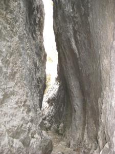 a cave in a rock wall with a tunnel in it at CASA BERNAT in Aren