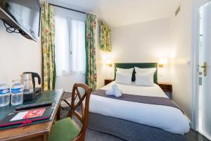 Postel nebo postele na pokoji v ubytování France Louvre + 19 fotografií