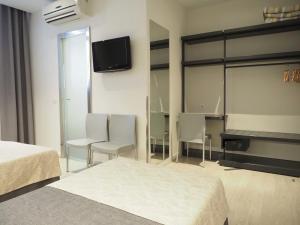 Posteľ alebo postele v izbe v ubytovaní Hostal Benidorm