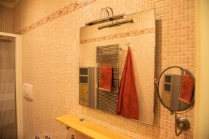 a mirror on the wall of a bathroom at Casa del Grillo in Molfetta