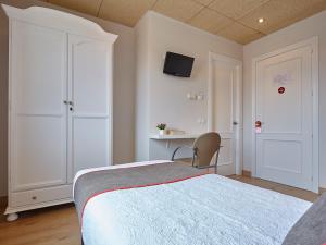 Cama o camas de una habitación en Hostal Nobadis