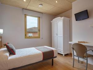 Cama o camas de una habitación en Hostal Nobadis
