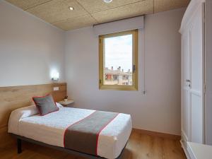 Cama o camas de una habitación en Hostal Nobadis