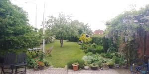 a garden with a lot of plants and flowers at My Bureau Apartment in Korsør