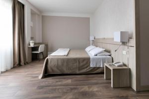 Cama ou camas em um quarto em Hotel Conradi