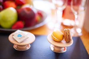 two small plates of food on a table with fruit at Grupotel Parc Natural & Spa in Playa de Muro