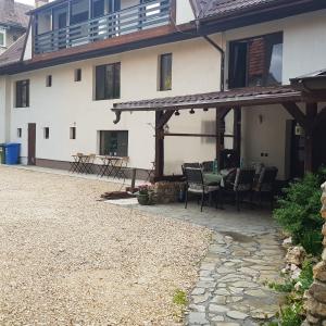 an outside view of a house with a patio at Casa Bergwald in Râşnov