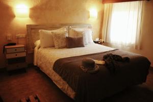 Posteľ alebo postele v izbe v ubytovaní Hotel Sant Joan